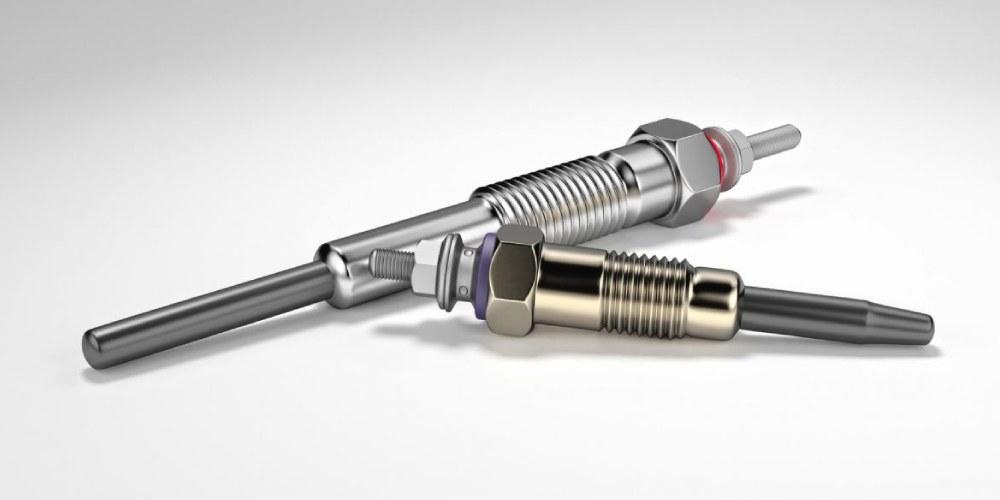  A 3D rendering of three glow plugs on a neutral background.